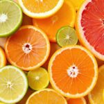 A vibrant arrangement of 10 powerful immune-boosting foods including colorful fruits, vegetables, and natural ingredients